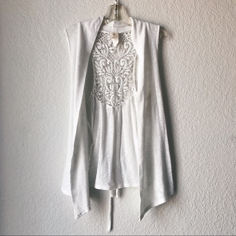 white sleeveless cardigan